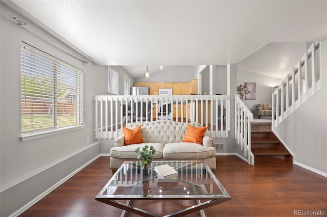 13906 Jackson St, Thornton, CO 80602 - living area with wood finished floors, vaulted ceiling, and baseboards