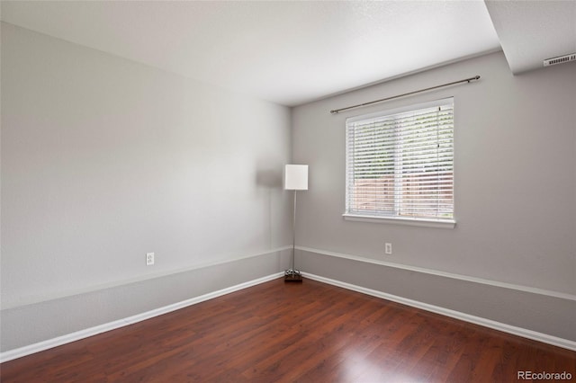 13906 Jackson St, Thornton, CO 80602 - empty room featuring baseboards and dark wood-style flooring