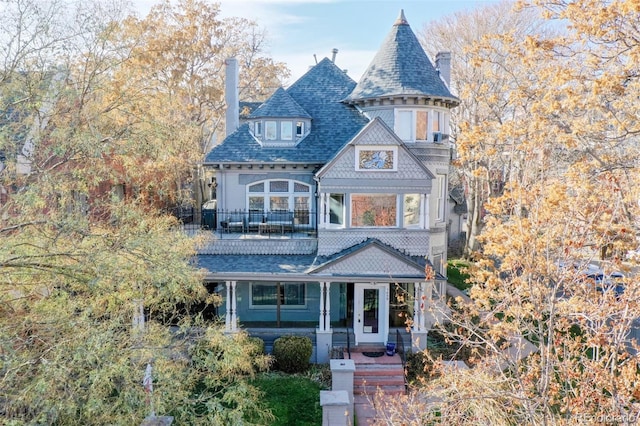 victorian-style house with a chimney