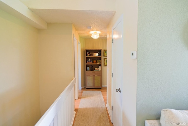 12498 W Prentice Dr, Littleton, CO 80127 - hallway with light wood-type flooring