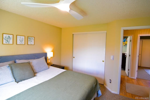 12498 W Prentice Dr, Littleton, CO 80127 - bedroom with a closet, ceiling fan, and a textured ceiling