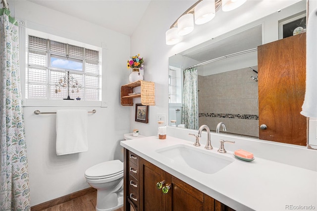 full bathroom with a shower with curtain, toilet, wood finished floors, baseboards, and vanity