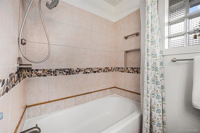 full bathroom with shower / bath combo with shower curtain