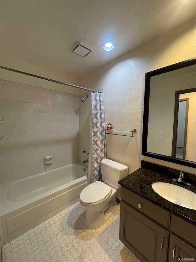 full bathroom with vanity, toilet, and shower / tub combo