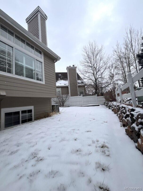 view of yard layered in snow