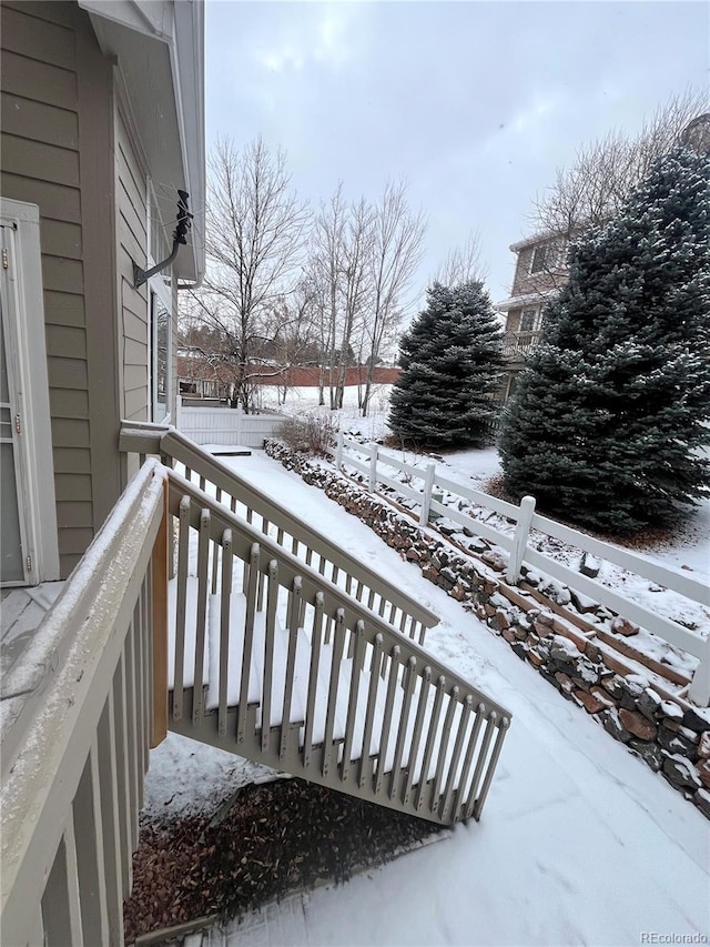 view of snow covered deck