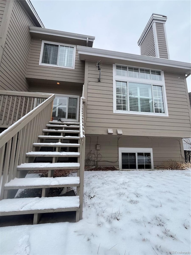 view of snow covered house