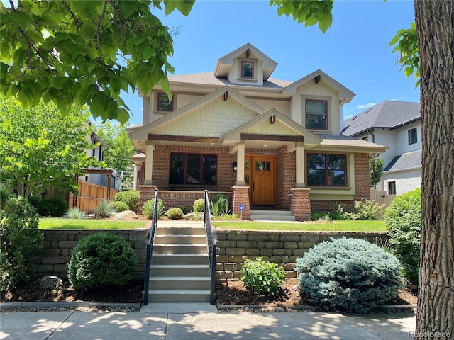 1145 S Williams St, Denver, CO 80210 - view of front of home with a porch and brick siding
