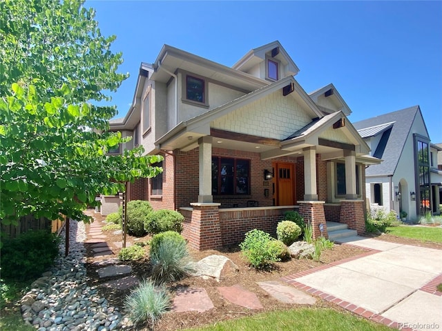 1145 S Williams St, Denver, CO 80210 - view of front of property with a porch and brick siding