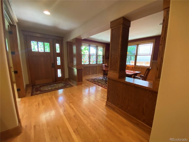 1145 S Williams St, Denver, CO 80210 - foyer with light wood-style flooring, decorative columns, and recessed lighting