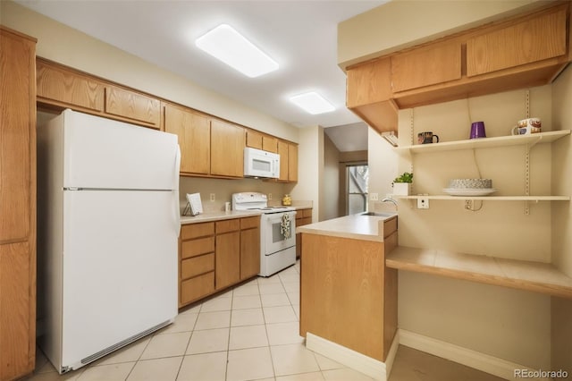 3330 Templeton Gap Rd Unit 15, Colorado Springs, CO 80907 - kitchen with white appliances, a sink, light countertops, open shelves, and light tile patterned floors