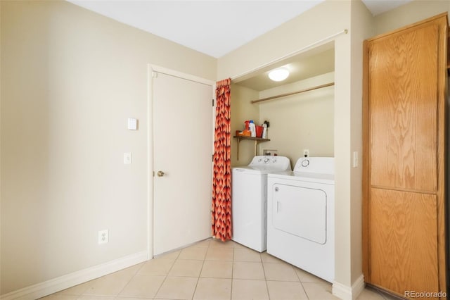 3330 Templeton Gap Rd Unit 15, Colorado Springs, CO 80907 - washroom with separate washer and dryer, light tile patterned floors, and baseboards