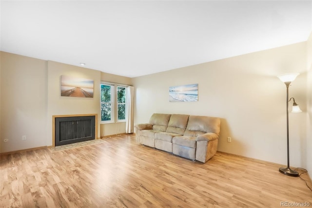 3330 Templeton Gap Rd Unit 15, Colorado Springs, CO 80907 - living room with wood finished floors and a fireplace with flush hearth