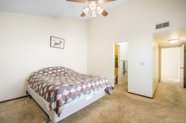 3330 Templeton Gap Rd Unit 15, Colorado Springs, CO 80907 - bedroom featuring light colored carpet, a towering ceiling, baseboards, and ceiling fan