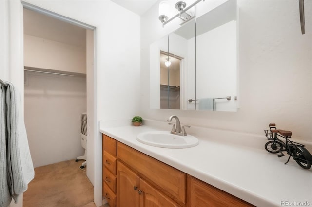 3330 Templeton Gap Rd Unit 15, Colorado Springs, CO 80907 - bathroom with vanity, toilet, and a walk in closet