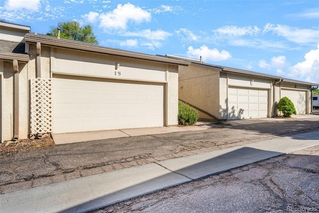 3330 Templeton Gap Rd Unit 15, Colorado Springs, CO 80907 - view of front of property with stucco siding and community garages