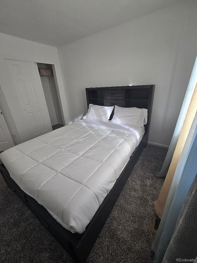 carpeted bedroom with a closet