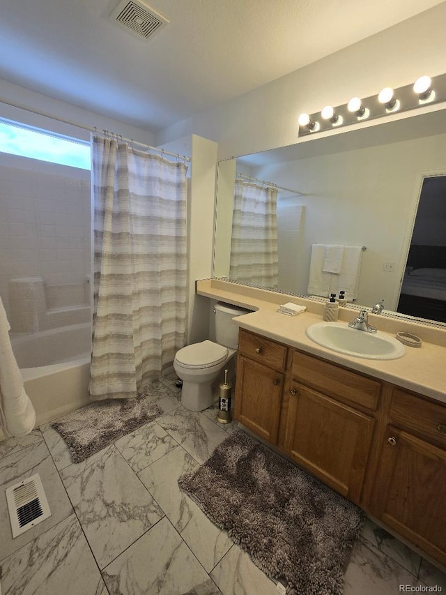 full bathroom featuring vanity, shower / bath combo, and toilet