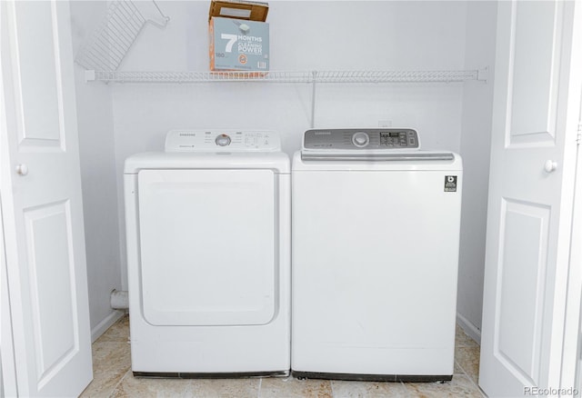 washroom with washing machine and dryer