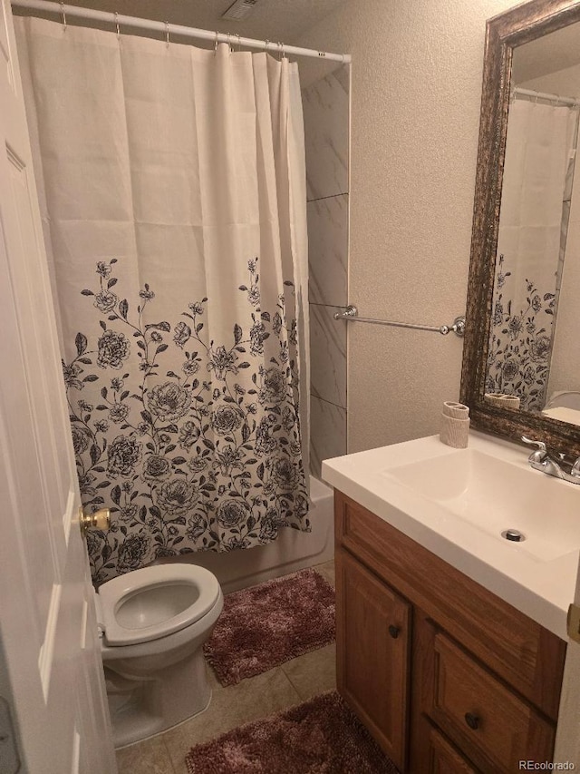 full bathroom featuring tile patterned floors, vanity, toilet, and shower / tub combo with curtain