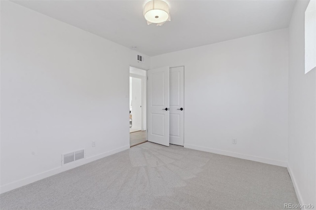 spare room with light carpet