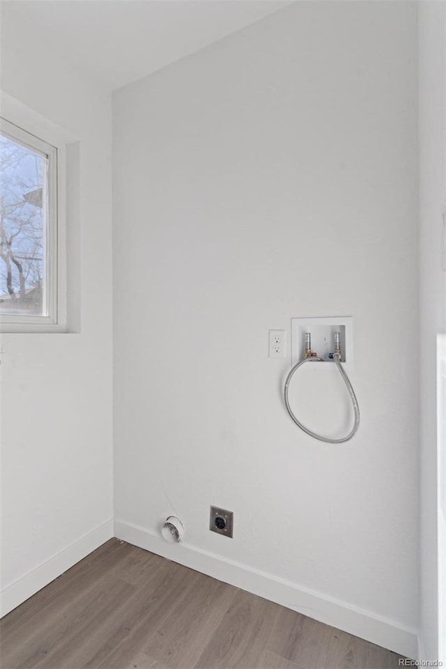 laundry room featuring hookup for a washing machine, hookup for an electric dryer, and hardwood / wood-style floors