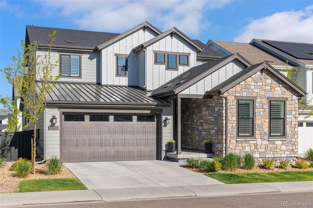 11103 Cloud Shadow St, Littleton, CO 80125 - view of front of home featuring an attached garage, a standing seam roof, stone siding, concrete driveway, and board and batten siding