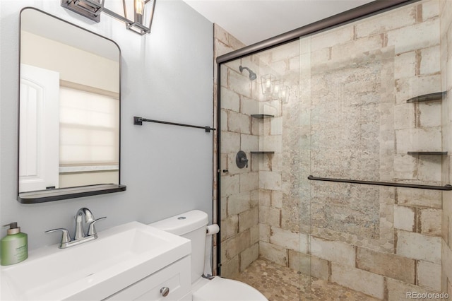 full bathroom featuring vanity, toilet, and a stall shower