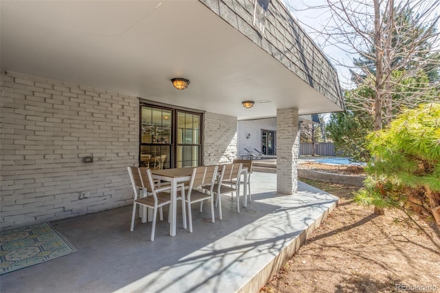 view of patio featuring outdoor dining area