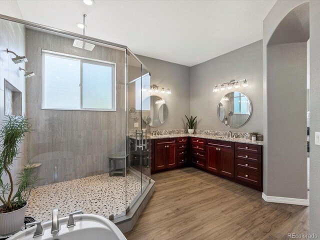 10531 Lieter Pl, Lone Tree, CO 80124 - bathroom featuring a shower stall, vanity, wood finished floors, and a bidet