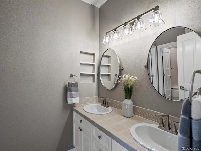 10531 Lieter Pl, Lone Tree, CO 80124 - full bathroom with double vanity and a textured wall