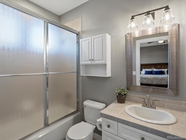 10531 Lieter Pl, Lone Tree, CO 80124 - ensuite bathroom with vanity, toilet, bath / shower combo with glass door, and a textured wall