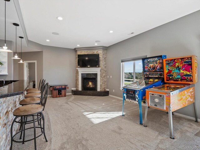 10531 Lieter Pl, Lone Tree, CO 80124 - rec room with carpet floors, a lit fireplace, baseboards, and recessed lighting