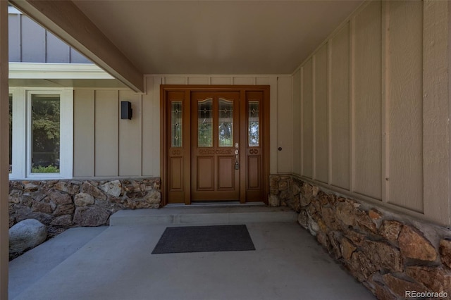 4398 Carter Trl, Boulder, CO 80301 - view of exterior entry with board and batten siding and stone siding