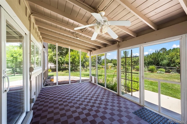 4398 Carter Trl, Boulder, CO 80301 - unfurnished sunroom with ceiling fan, beamed ceiling, and view of wooded area