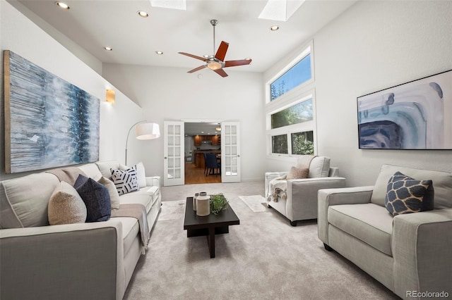 4398 Carter Trl, Boulder, CO 80301 - living room with a skylight, french doors, a high ceiling, carpet floors, and a ceiling fan