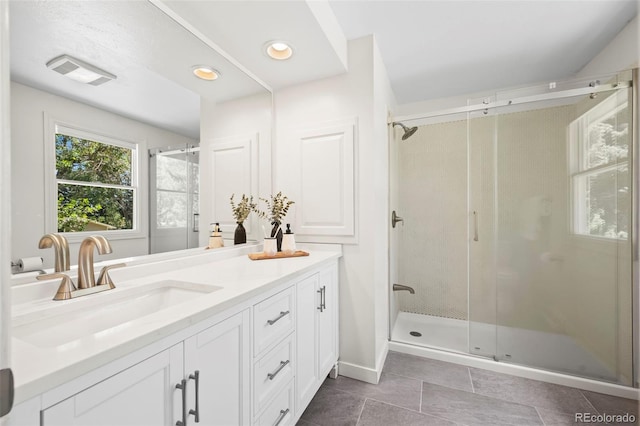 4398 Carter Trl, Boulder, CO 80301 - full bath with double vanity, a shower stall, tile patterned flooring, and recessed lighting
