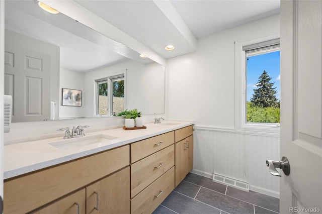 4398 Carter Trl, Boulder, CO 80301 - bathroom with double vanity, tile patterned floors, wainscoting, and recessed lighting