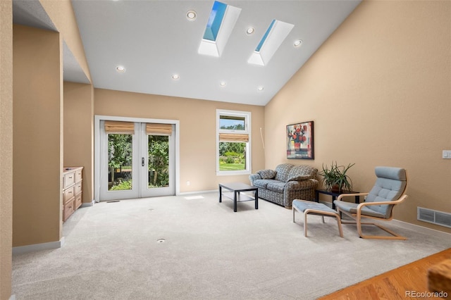4398 Carter Trl, Boulder, CO 80301 - living area with plenty of natural light, a skylight, high vaulted ceiling, french doors, and recessed lighting