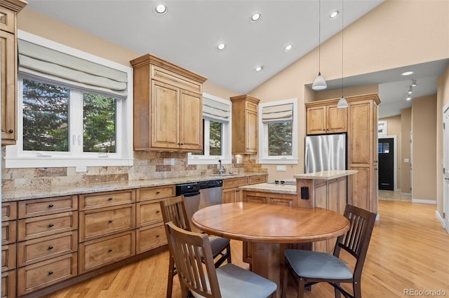 4398 Carter Trl, Boulder, CO 80301 - kitchen featuring appliances with stainless steel finishes, backsplash, a center island, light wood finished floors, and recessed lighting