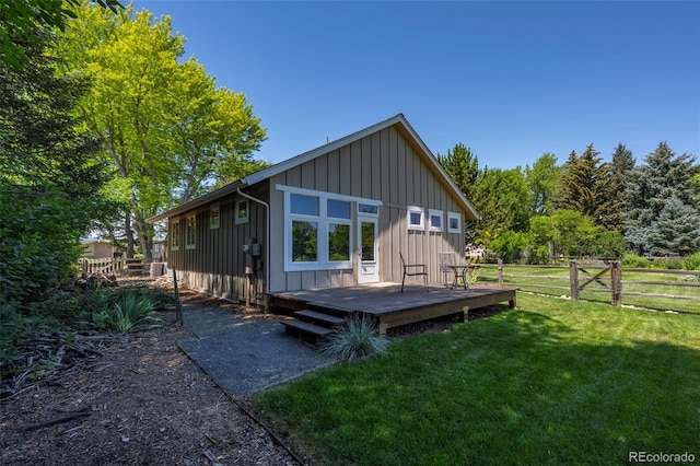4398 Carter Trl, Boulder, CO 80301 - rear view of house with board and batten siding and a wooden deck