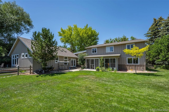 4398 Carter Trl, Boulder, CO 80301 - rear view of property featuring a sunroom, board and batten siding, and a shingled roof