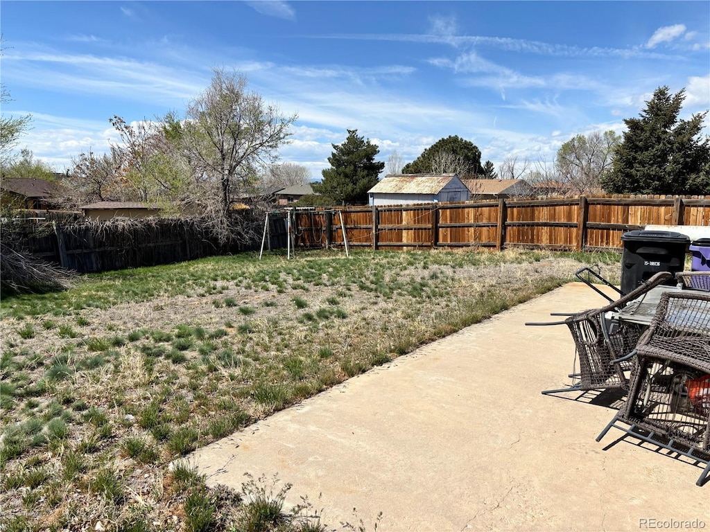view of yard with a fenced backyard and a patio area