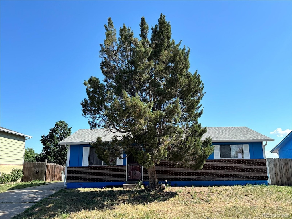 14832 Elmendorf Pl, Denver, CO 80239 - view of front of property featuring brick siding