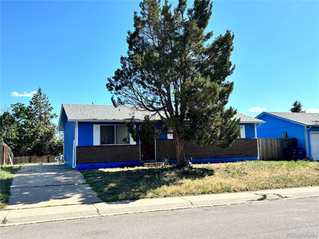 14832 Elmendorf Pl, Denver, CO 80239 - view of front facade with brick siding