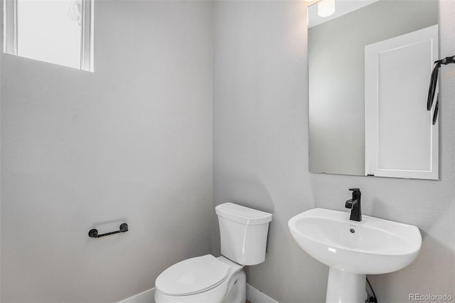 bathroom featuring toilet and sink