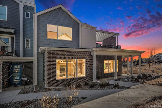 exterior space with brick siding