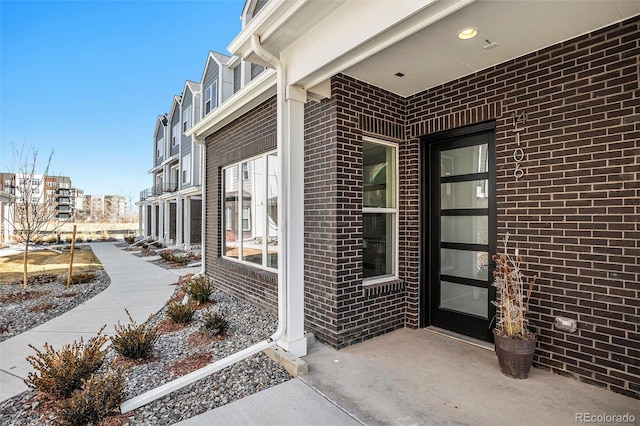 entrance to property with brick siding