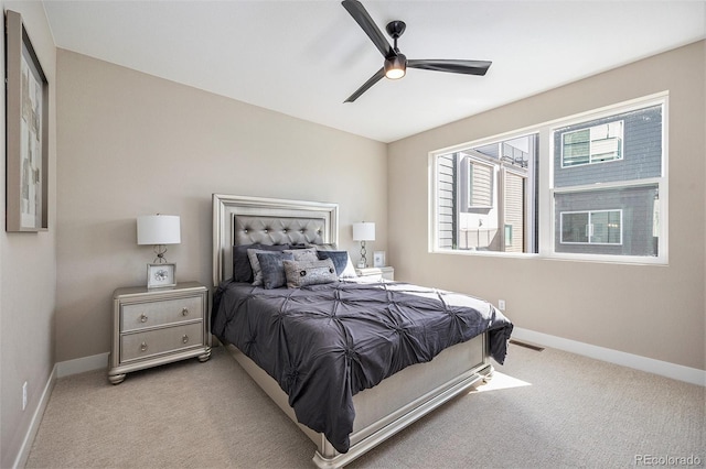 bedroom with carpet flooring, a ceiling fan, and baseboards