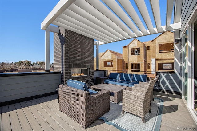 wooden deck with an outdoor living space with a fireplace